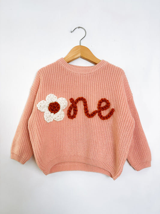 RTS 12-18 mo. pink sweater w/ “one”